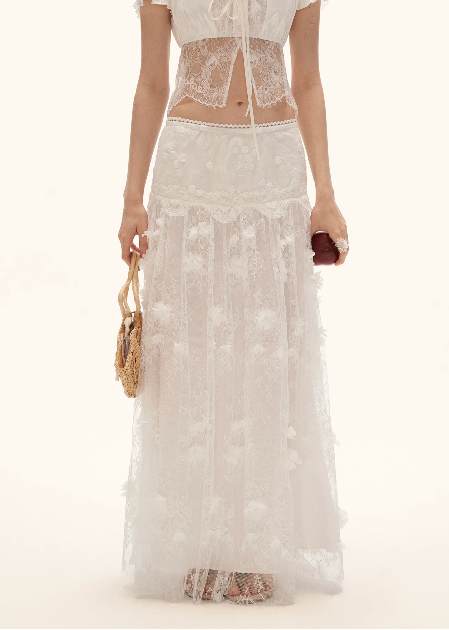 white maxi skirt women, gauze maxi skirt, floral embellished skirt, french style skirt women, summer 2026 outfits, elegant summer skirt, airy long skirt women, romantic white skirt, vacation outfit women, aesthetic summer outfit, feminine maxi skirt, flowy white skirt, high waist maxi skirt, resort style skirt, chic summer outfit, lightweight long skirt, statement white skirt, graceful summer look, elevated feminine outfit, soft luxury skirt