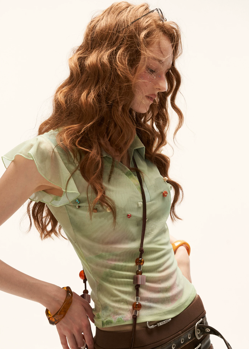 summer 2026 outfits, summer outfit ideas, vacation outfit women, brunch outfit women, picnic outfit women, casual summer outfits women, sheer green top, vintage polo top women, flutter sleeve blouse, beaded summer top, french vintage outfit, european summer outfit, lightweight summer blouse, romantic summer fashion, soft aesthetic clothing