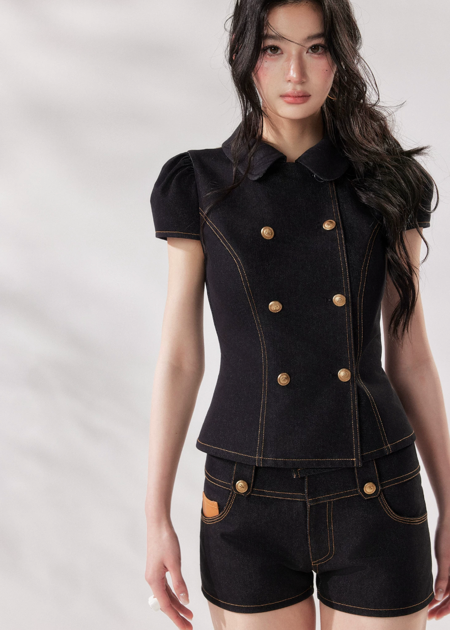 black denim set women, denim two piece set, structured denim outfit, double breasted top women, summer co ord set women, black short set outfit, modern minimalist outfit women, tailored denim set, chic summer outfit women, city style outfit women, fashion forward set women, clean line outfit women, edgy minimal fashion, elevated casual outfit, trendy denim set women