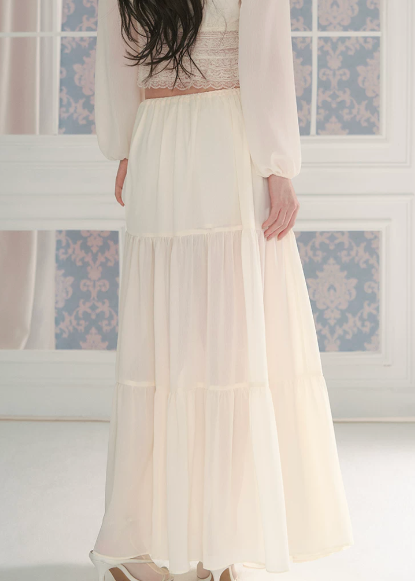 chiffon cake skirt, low rise maxi skirt, resort style skirt, tiered chiffon skirt, feminine Korean skirt, romantic summer skirt, draped long skirt, beach vacation skirt, airy summer skirt, soft chiffon maxi skirt, elegant resort outfit, flowing tiered skirt, Korean feminine fashion, vacation ready skirt, lightweight long skirt
