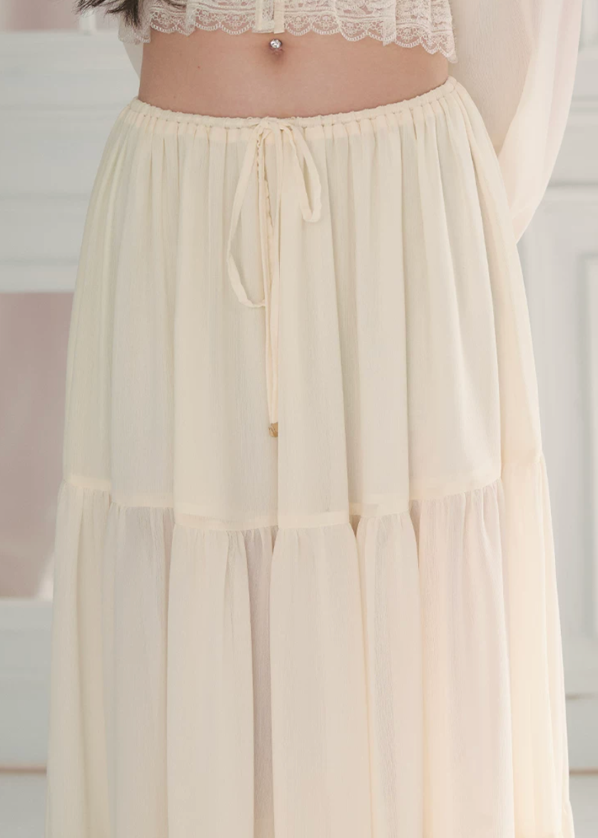 chiffon cake skirt, low rise maxi skirt, resort style skirt, tiered chiffon skirt, feminine Korean skirt, romantic summer skirt, draped long skirt, beach vacation skirt, airy summer skirt, soft chiffon maxi skirt, elegant resort outfit, flowing tiered skirt, Korean feminine fashion, vacation ready skirt, lightweight long skirt