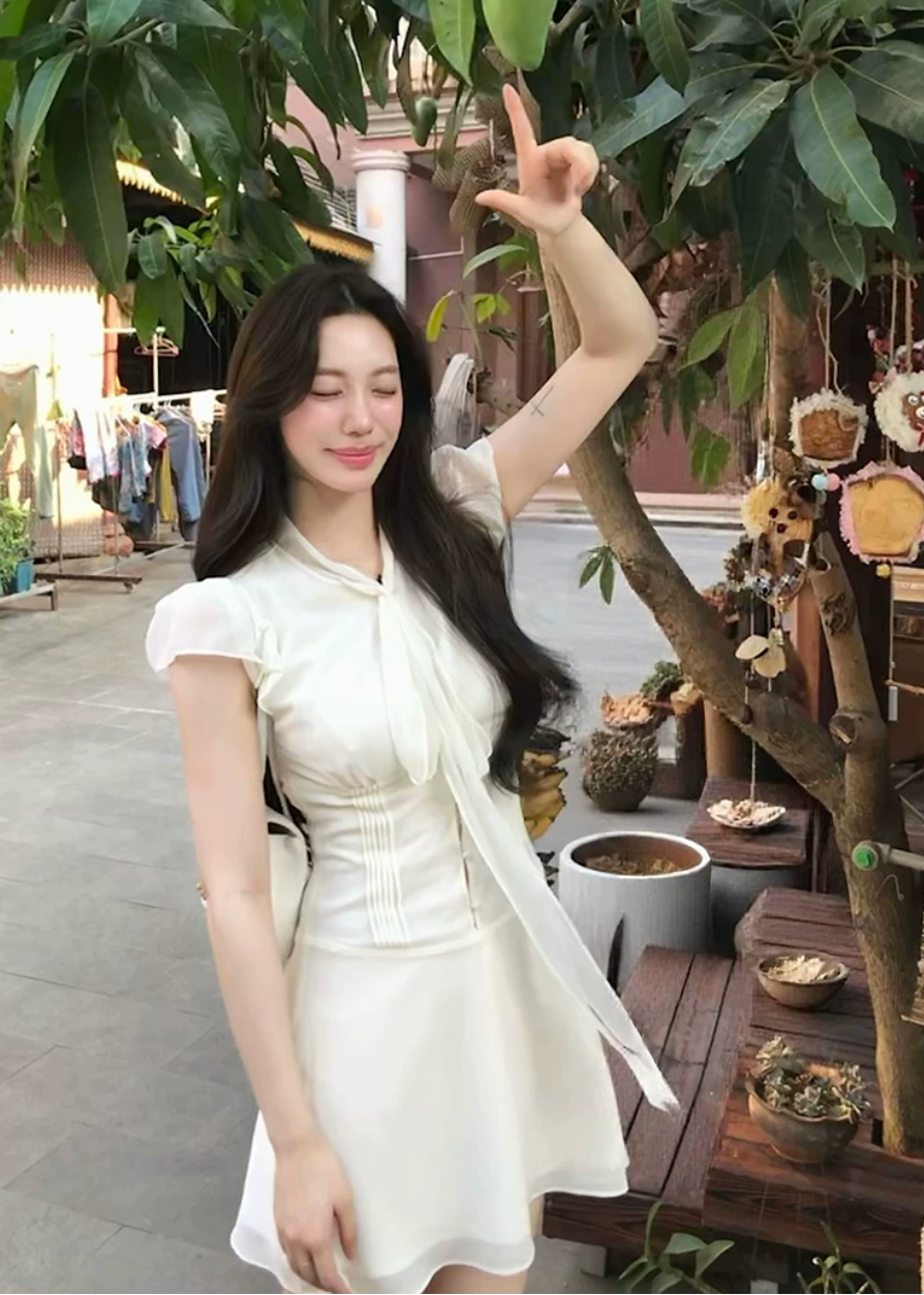 bow-tie chiffon mini dress, white chiffon dress, flutter sleeve mini dress, feminine korean dress, romantic summer dress, fit and flare mini dress, tie-neck dress, elegant white mini dress, soft girl summer dress, vacation mini dress, café date dress, graceful chiffon dress