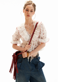 Sheer floral puff sleeve tie-front top