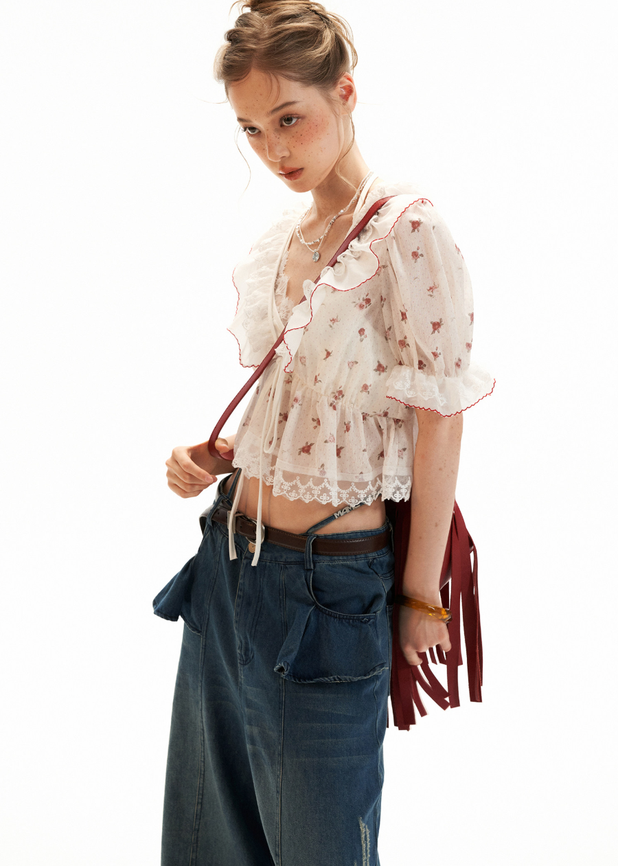 Sheer white top with ruffle neckline and short sleeves