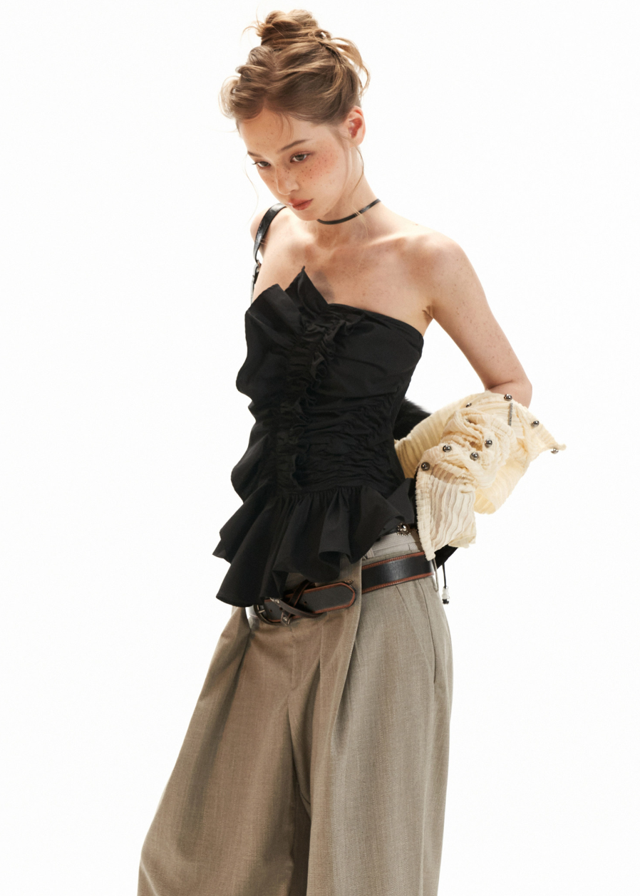 Y2K bandeau top styled with a pleated skirt