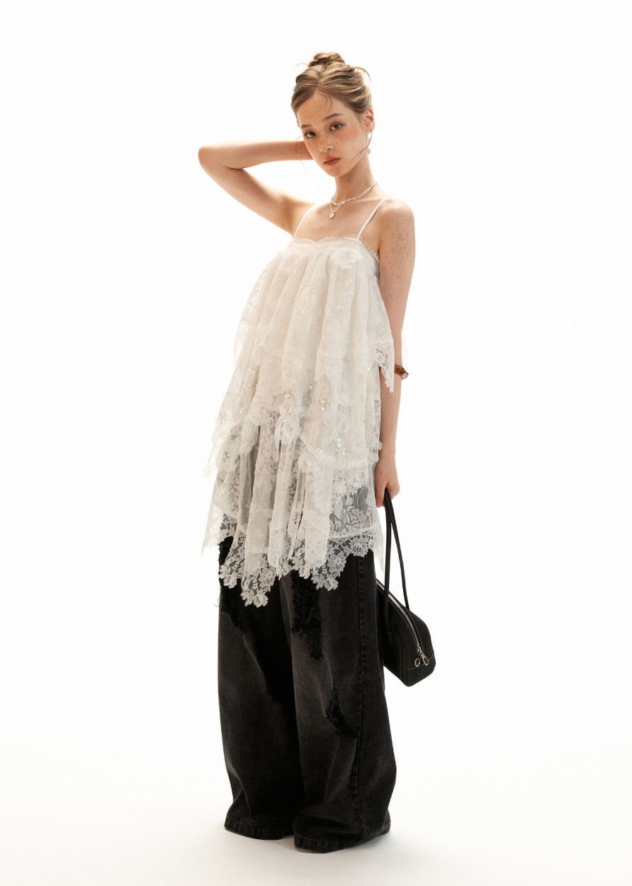 Sheer tiered lace slip dress styled with black wide-leg jeans