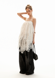 Sheer tiered lace slip dress styled with black wide-leg jeans