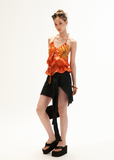 Warm orange drawstring halter top styled with lace shorts