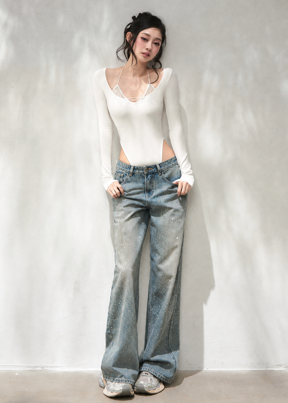 Halter-inspired knit top with delicate mesh and lace-up details