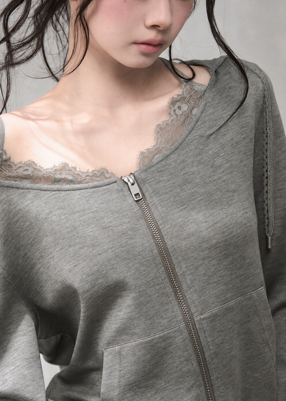 Women's cropped zip hoodie with delicate lace detailing and pockets