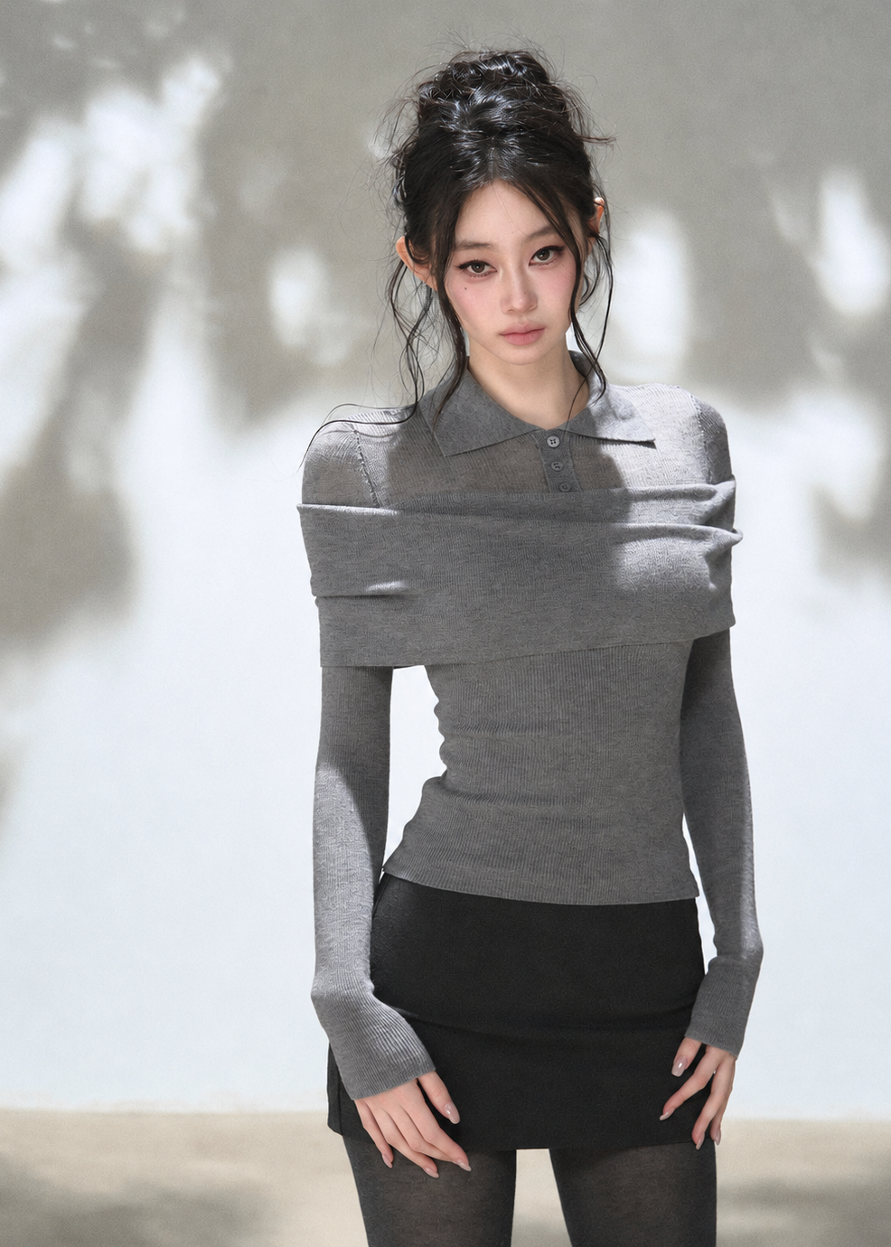 Grey off-shoulder draped polo knit top with foldover neckline