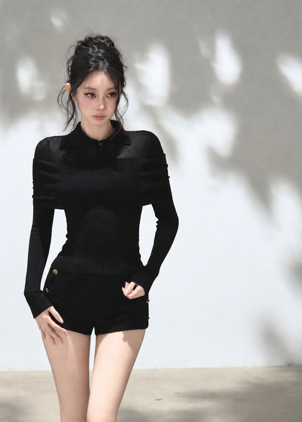 Black slim-fit polo knit top with asymmetric foldover shoulder design