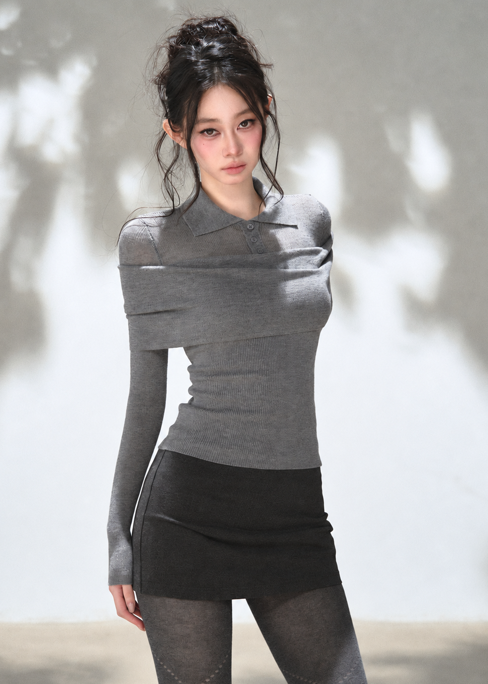 Grey off-shoulder draped polo knit top with foldover neckline