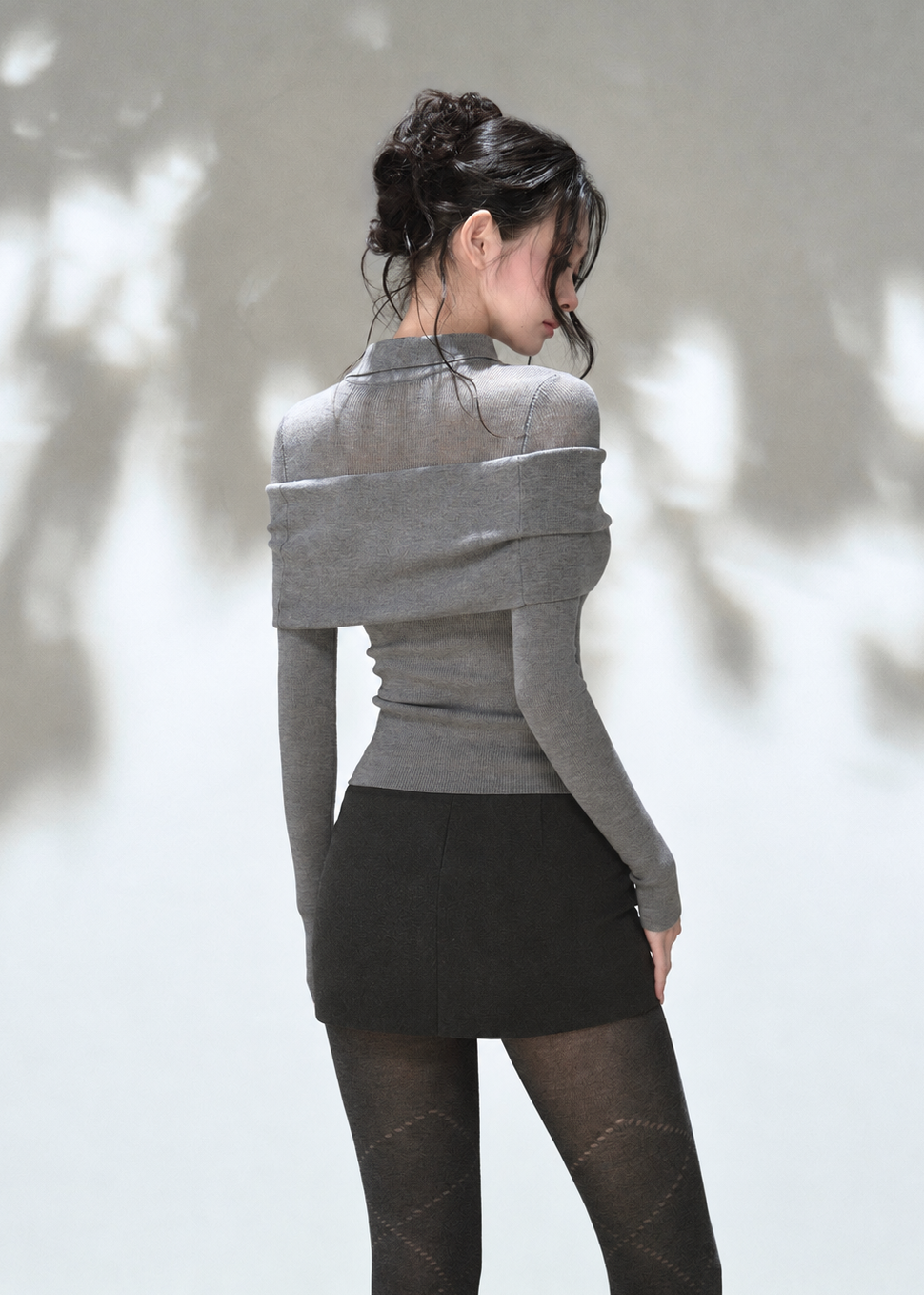 Grey off-shoulder draped polo knit top with foldover neckline