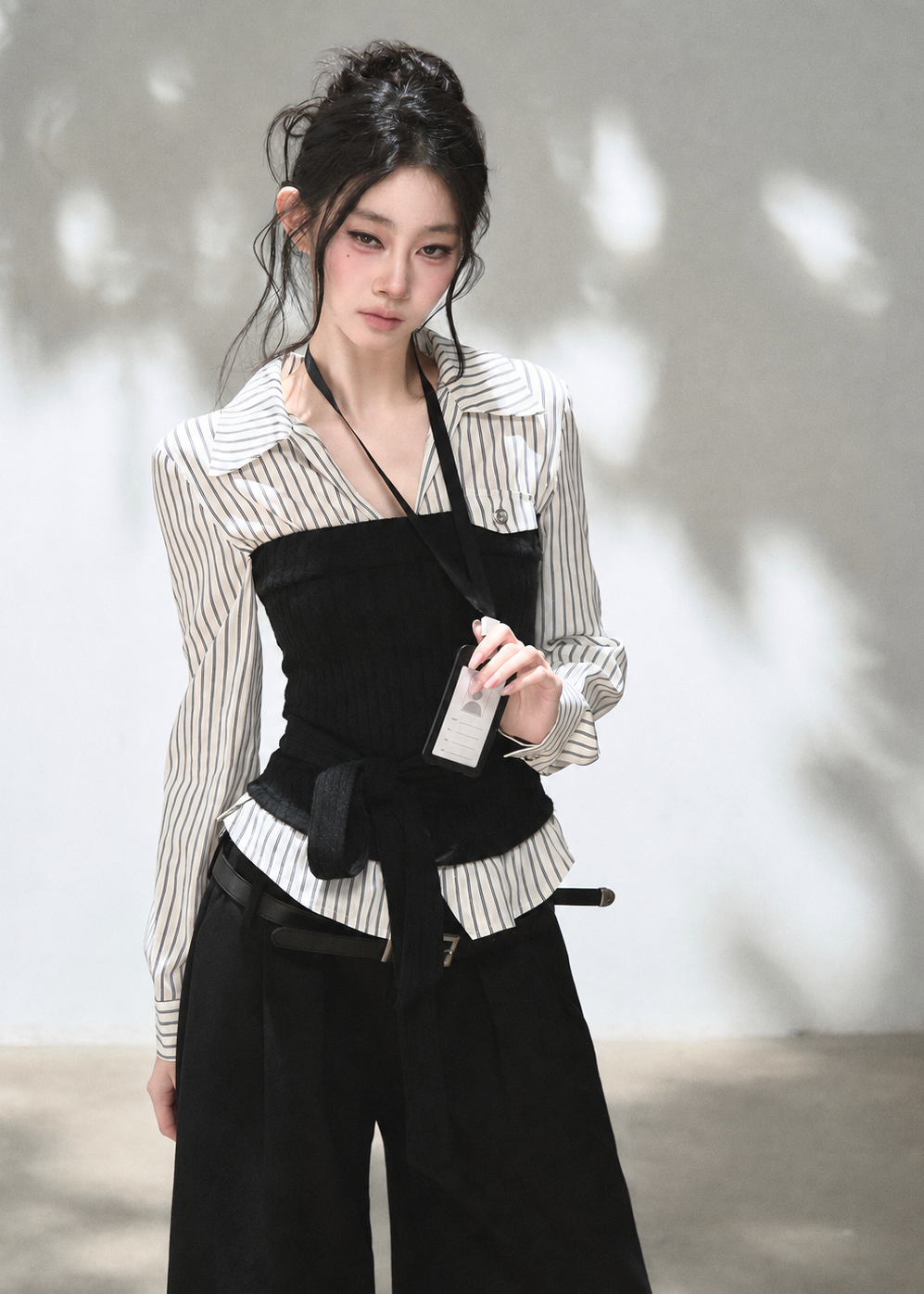 Blue striped shirt with grey textured knit corset overlay and waist tie