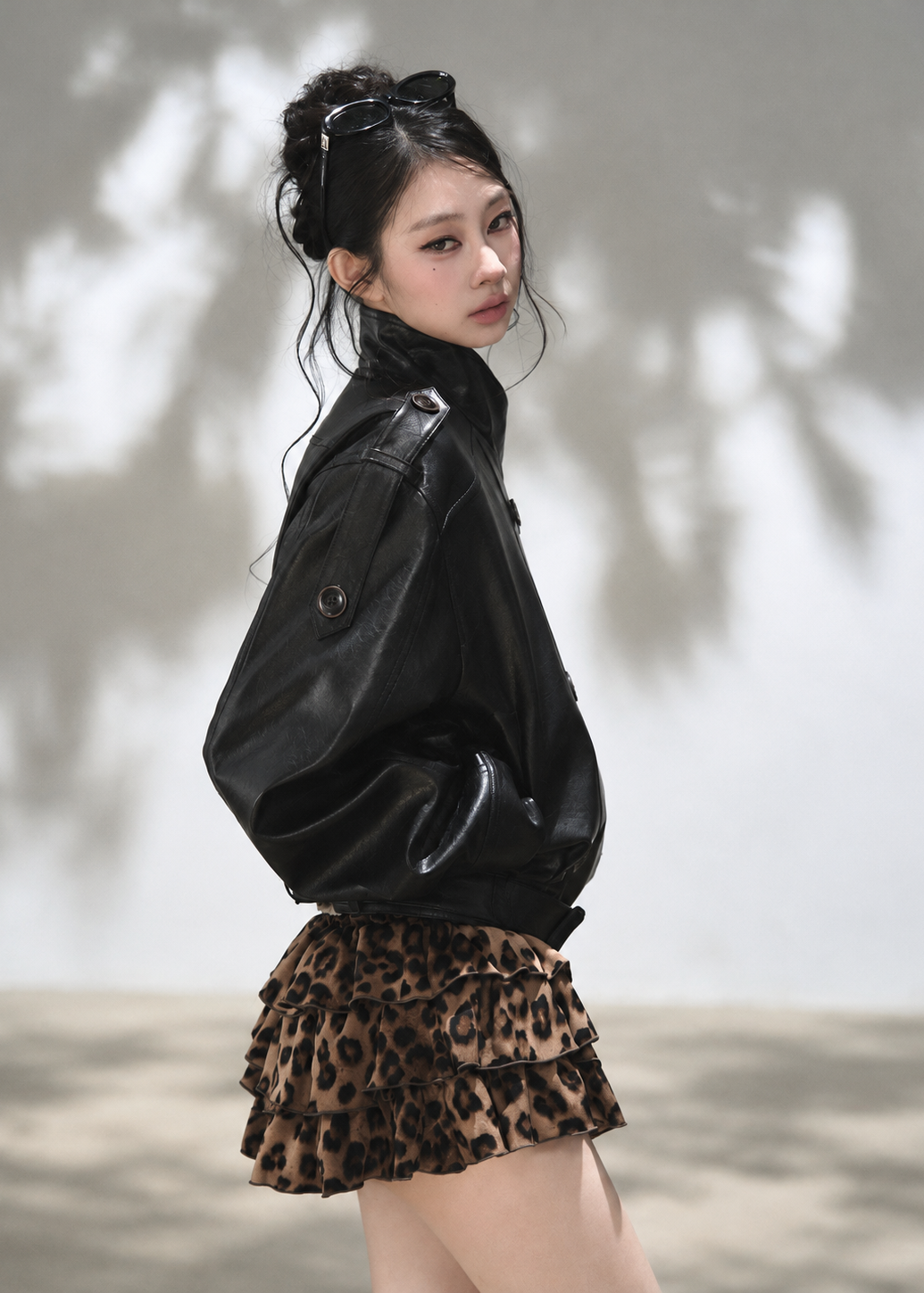 Black double-breasted cropped faux leather jacket with stand collar