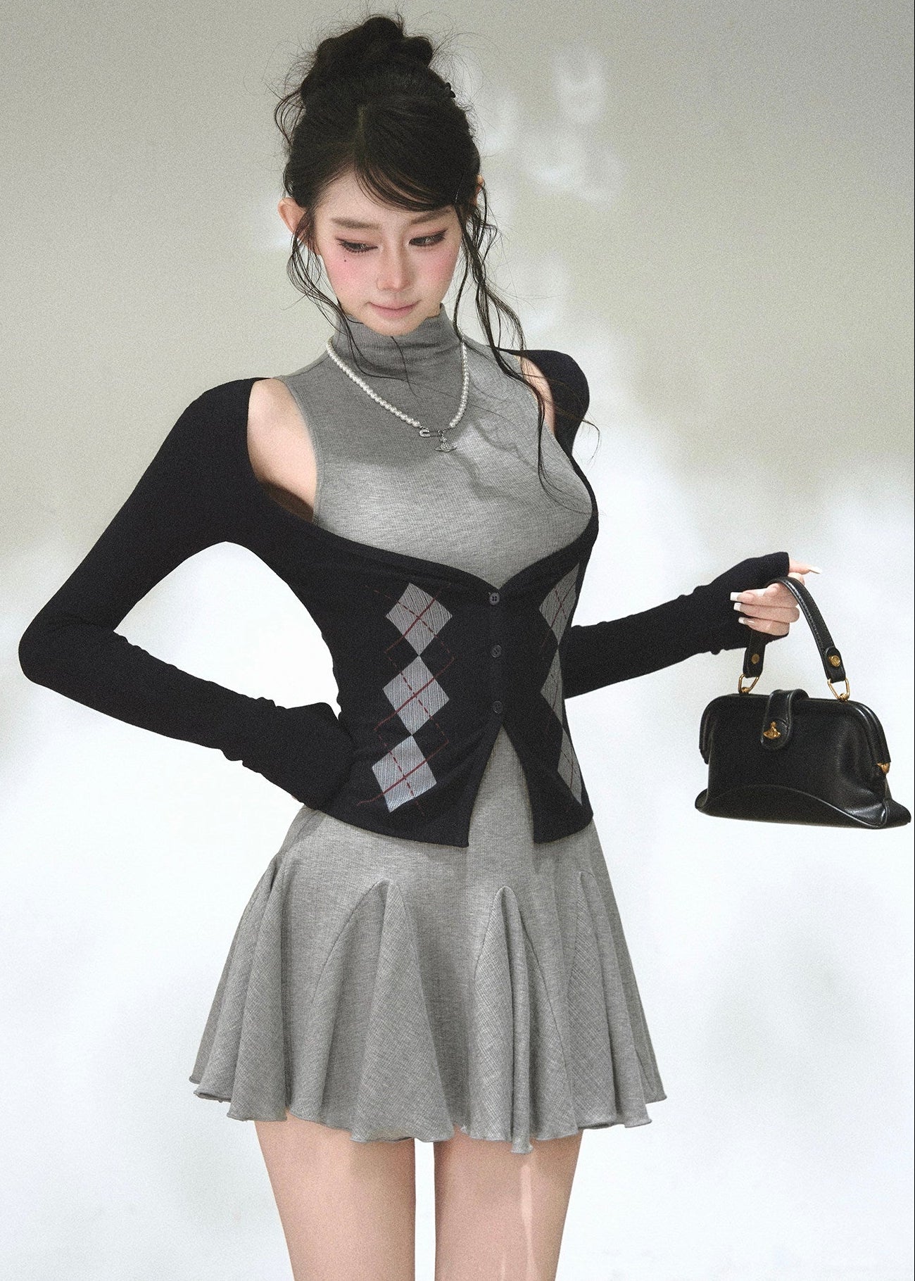 Argyle button-front cardigan with sleeveless high-neck mini dress