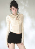Ivory argyle knit cardigan with pointed collar and keyhole neckline