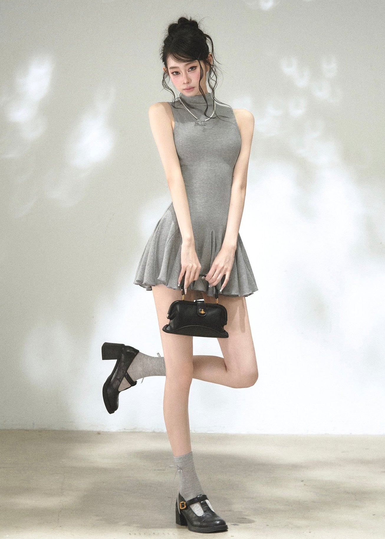 Argyle button-front cardigan with sleeveless high-neck mini dress