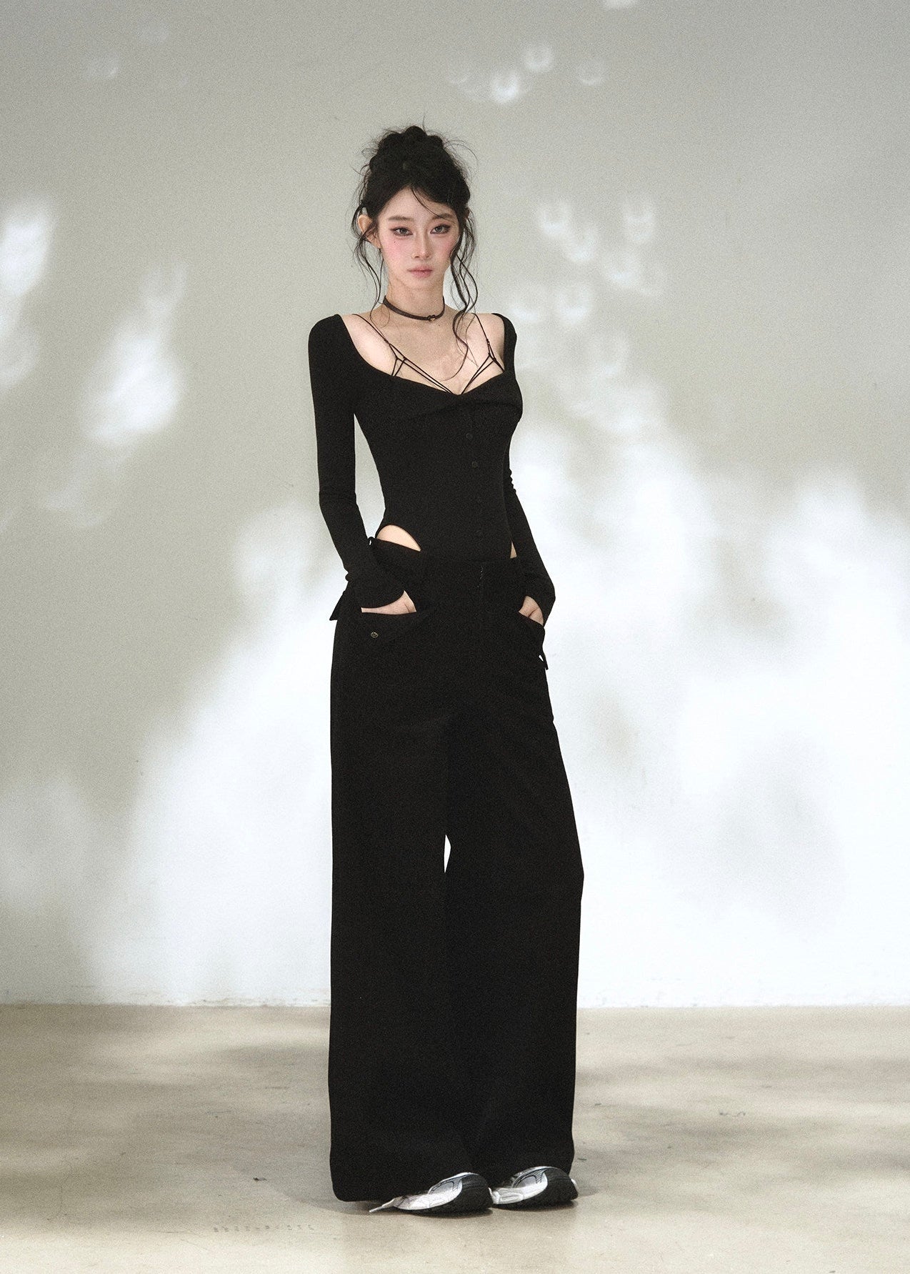Black sweetheart neckline long sleeve top with waist cutout details
