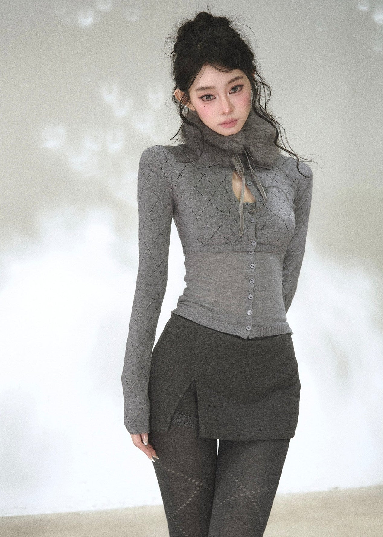 Women's fitted long sleeve argyle cardigan with button-front design