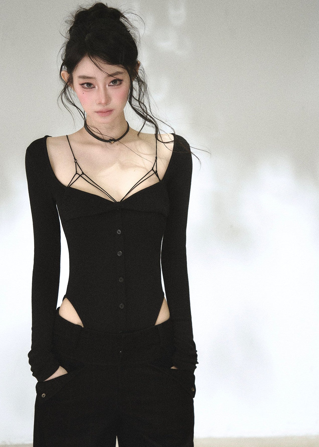 Black sweetheart neckline long sleeve top with waist cutout details