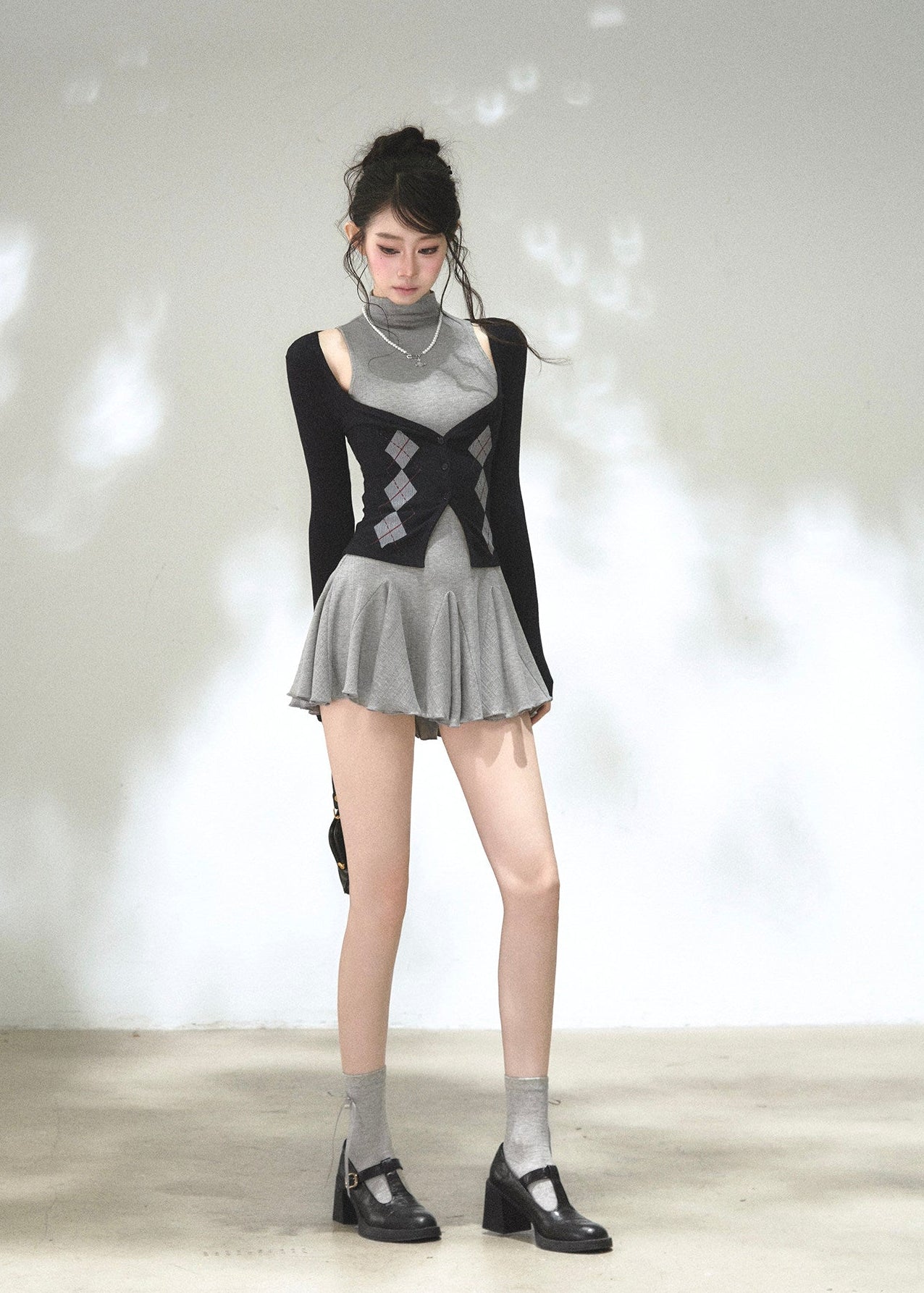 Argyle button-front cardigan with sleeveless high-neck mini dress