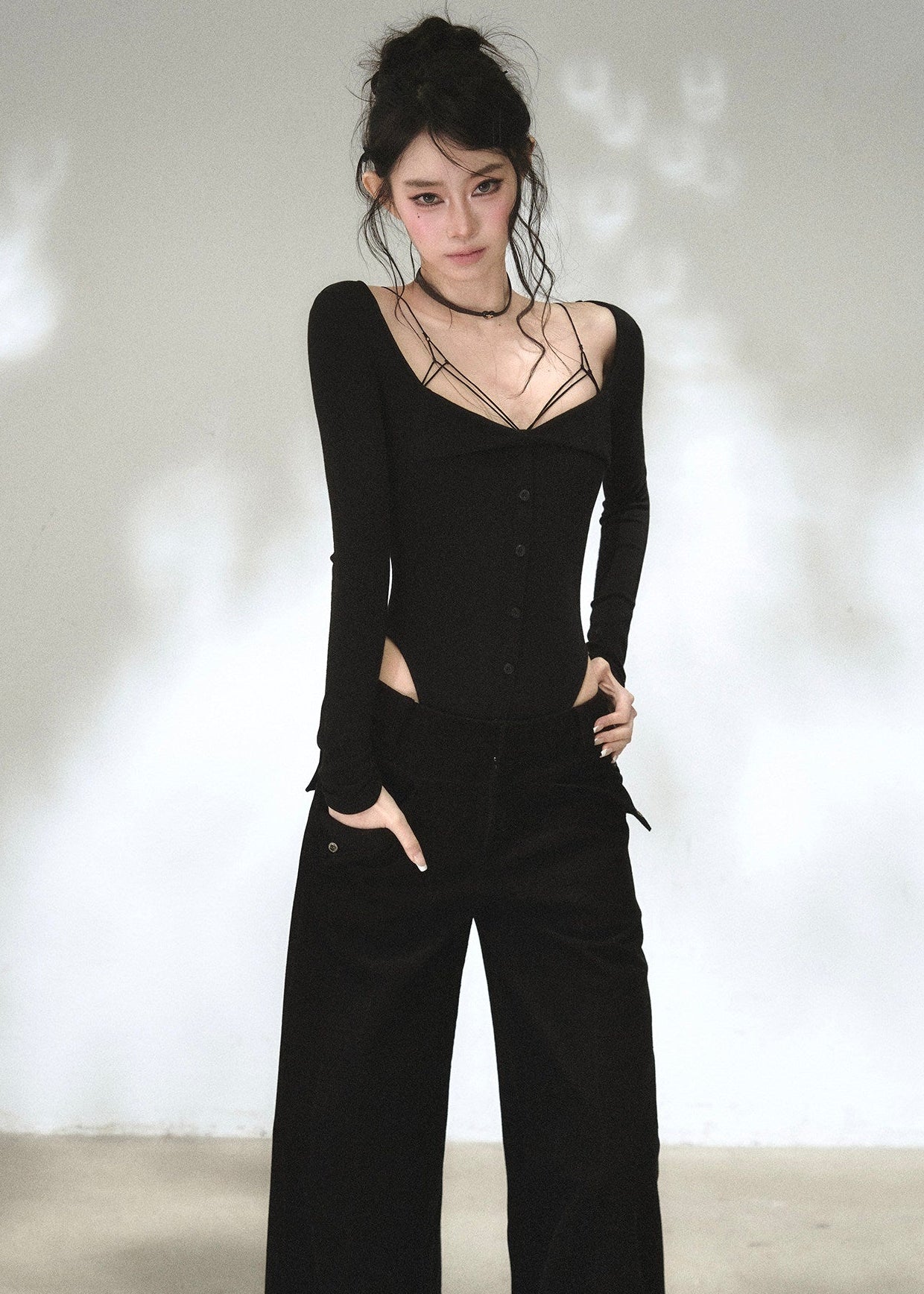 Black sweetheart neckline long sleeve top with waist cutout details