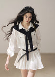 White collared shirt dress with navy shawl detail