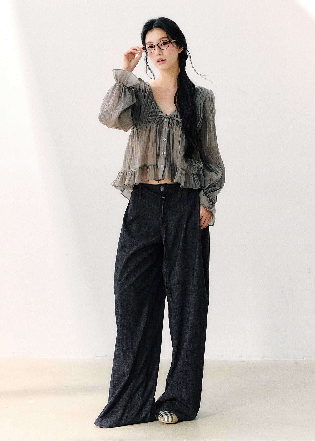 Smoky gray ruffled V-neck blouse with front ties