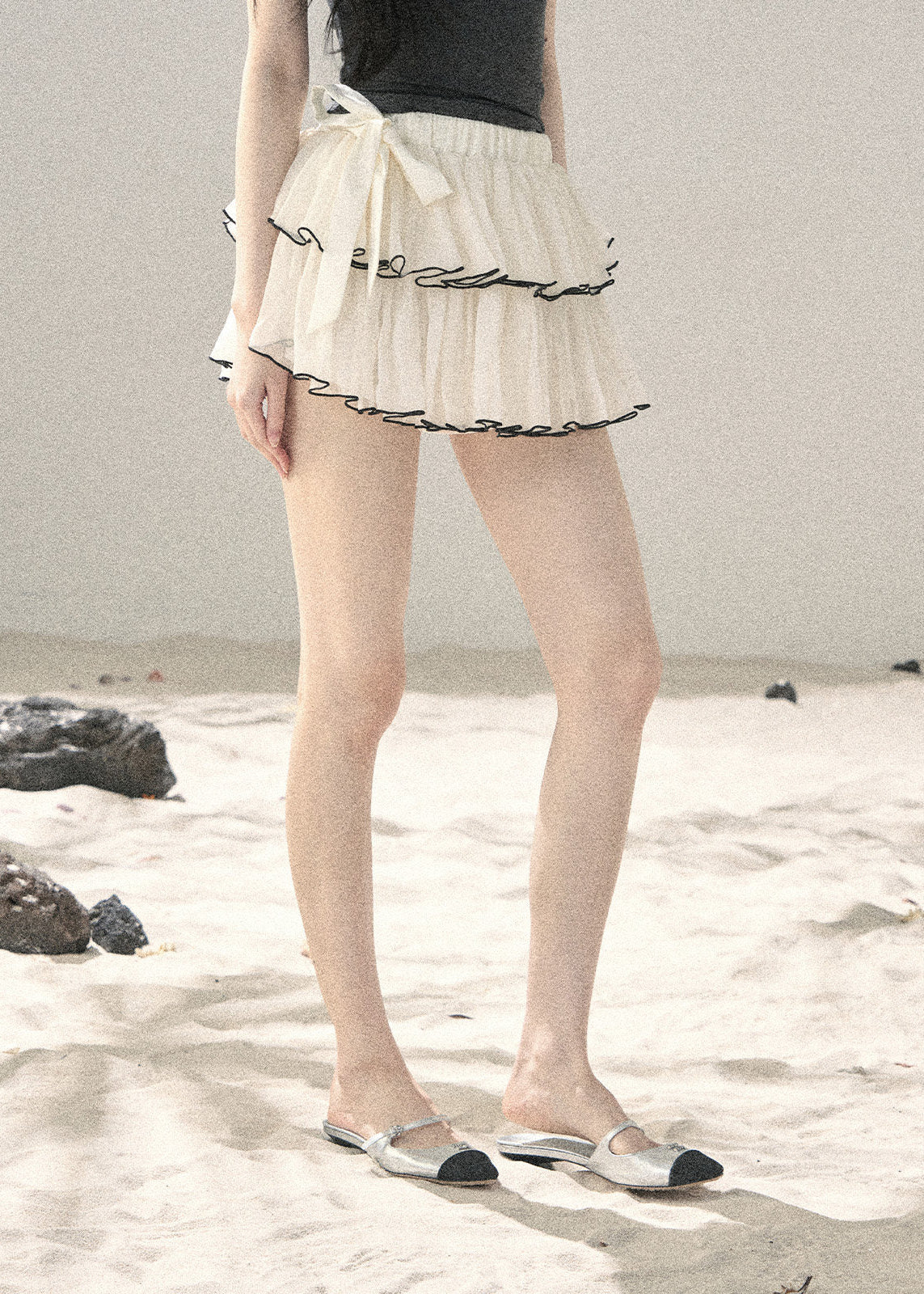 Ivory chiffon ruffle mini skirt with side bow