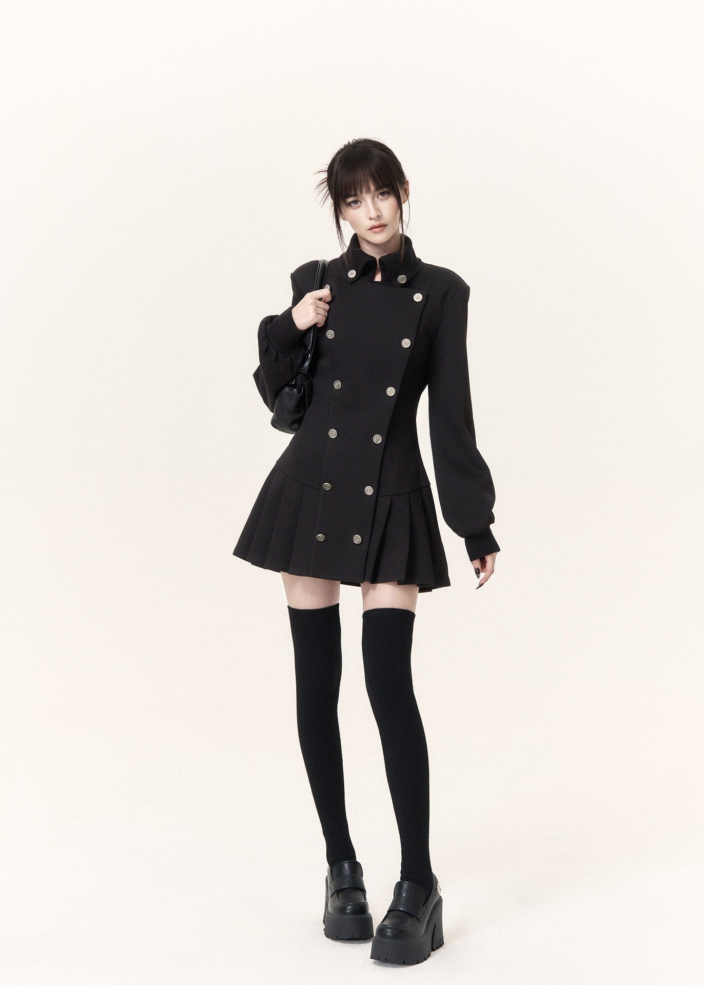 Military-inspired black mini dress with stand collar and pleated hem