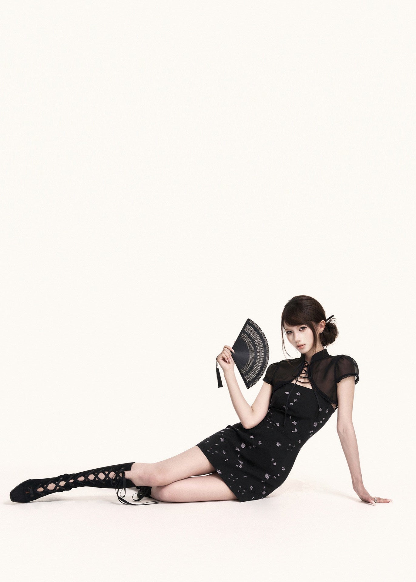 Strapless black mini dress with subtle floral print