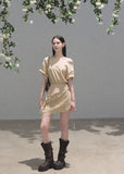 Warm neutral off-shoulder dress with layered chiffon and lace details