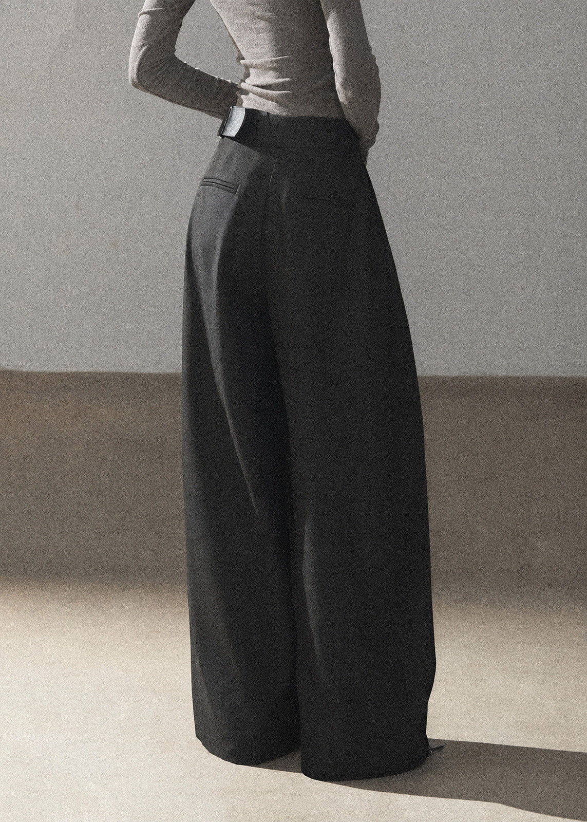 Model wearing taupe loose wide-leg pants