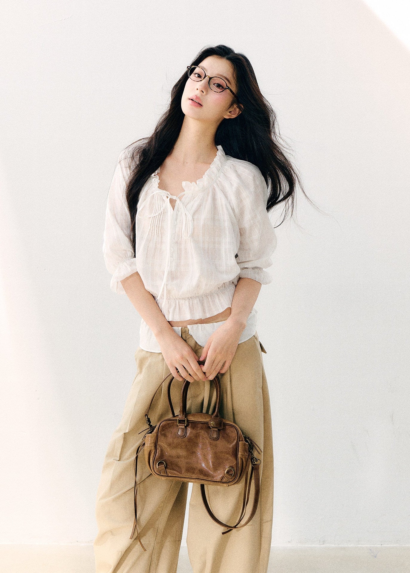 White cotton blouse with gathered wave pleats and puff sleeves