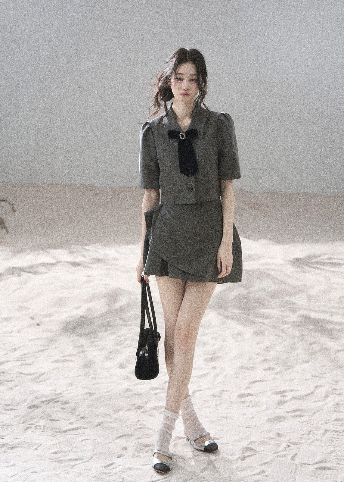 Gray tailored blazer skirt set with softly structured shoulders