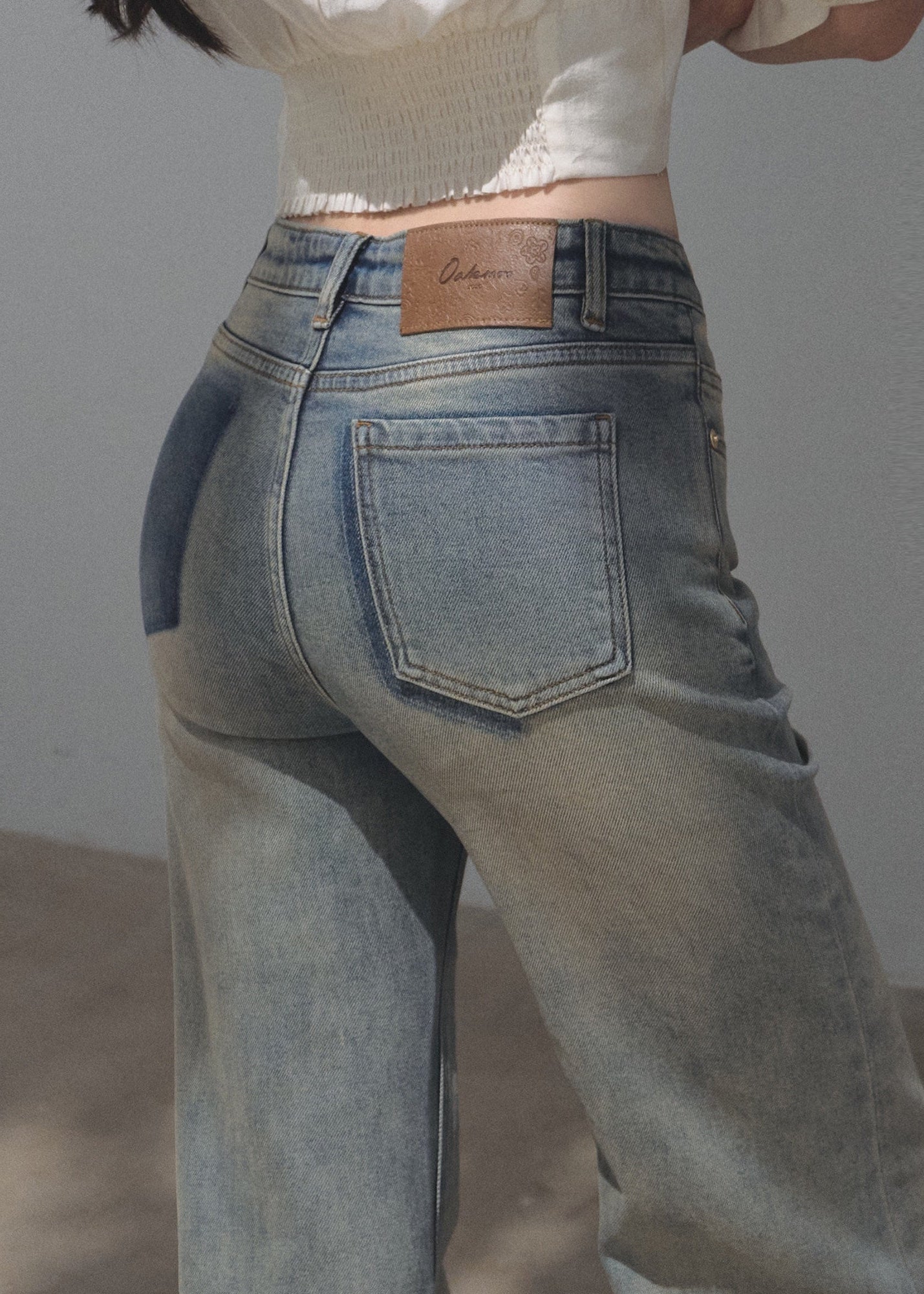 Gradient-wash wide-leg jeans in faded blue and earthy beige