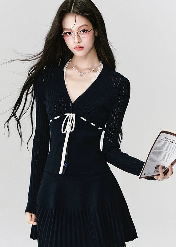 Fragileheart knit skirt set, black pleated two-piece, luxury Korean fashion, elegant autumn outfit, quiet luxury womenswear, pastel noir aesthetic, V-neck cardigan set, modern feminine K-fashion, minimalist ribbed knit, poetic fashion 2025, romantic fall outfit, delicate Korean style, sophisticated knitwear set, graceful pleated skirt look
