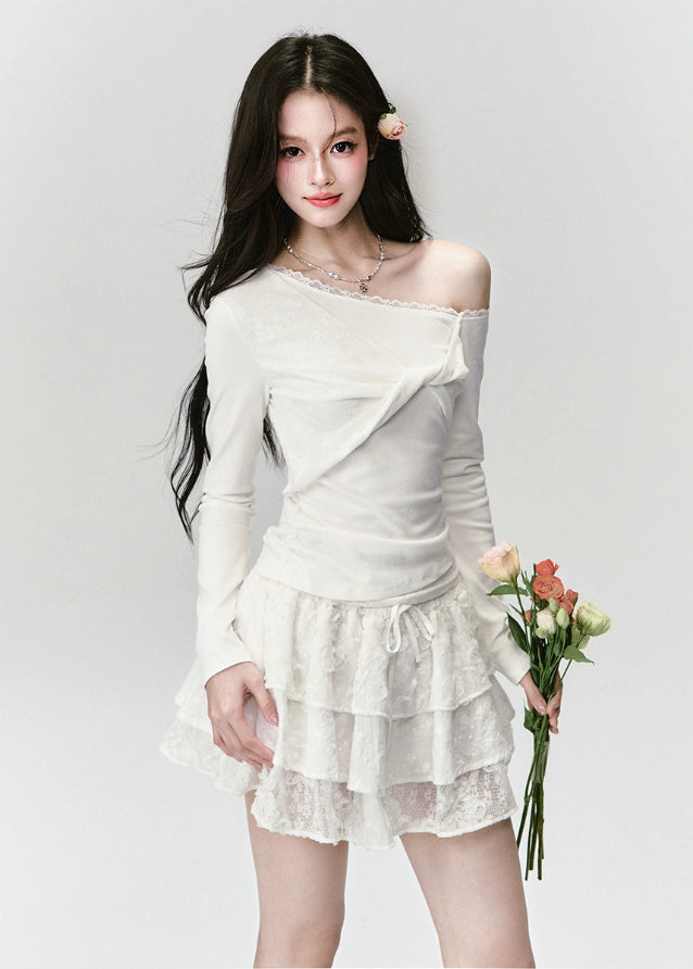 Fragileheart off-shoulder top, white lace blouse, asymmetric draped shirt, luxury Korean fashion, elegant feminine outfit, quiet luxury style, pastel noir aesthetic, winter 2025 collection, modern romantic fashion, ivory one-shoulder knit, soft lace trim top, minimalist luxury wear, Korean chic fashion, delicate off-shoulder blouse
