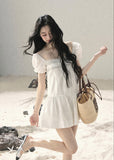 White puff-sleeve mini dress with square neckline