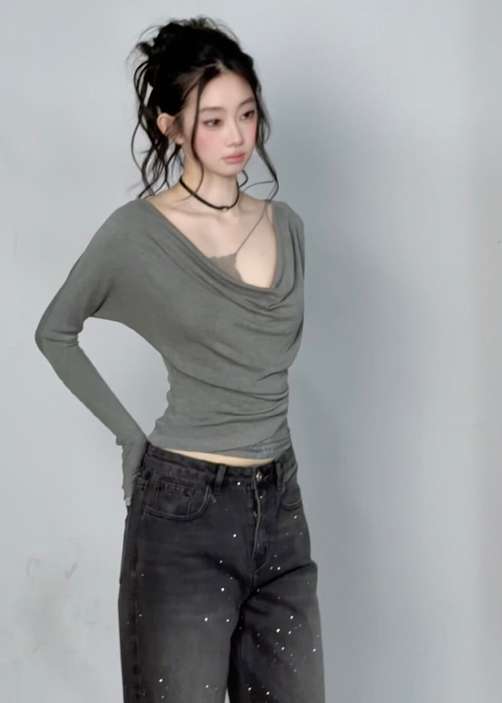 Fitted grey knit top with ruched waist and lace-trim inner layer