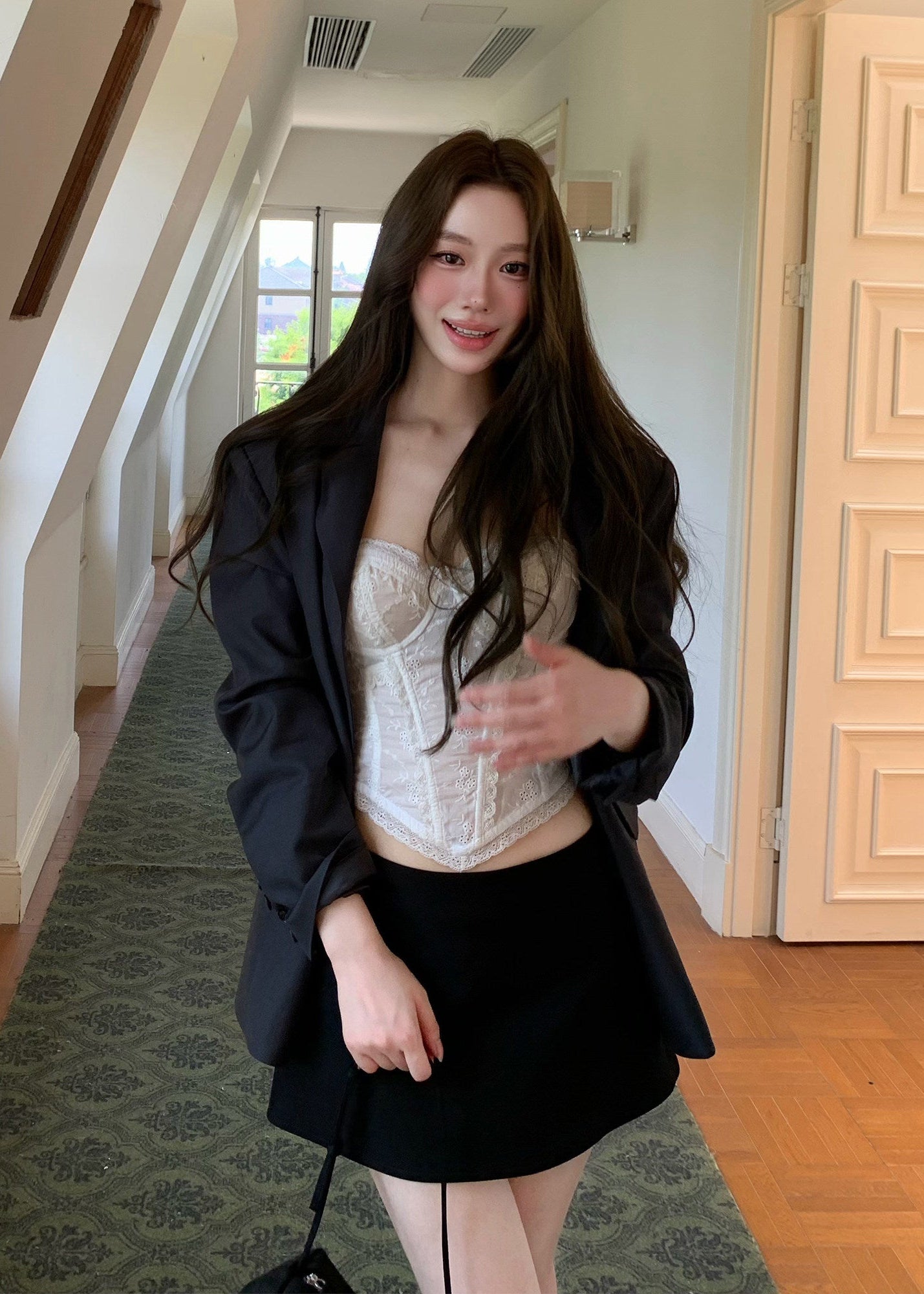 Charcoal gray oversized blazer with notched lapels and a two-button front
