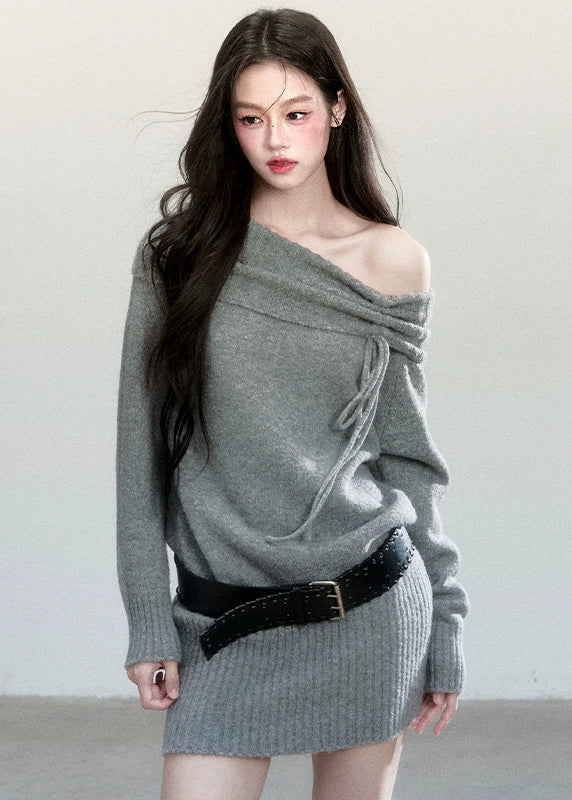 Fragileheart knit dress, off-shoulder wool dress, luxury Korean fashion, quiet luxury womenswear, grey sweater dress, pastel noir aesthetic, autumn knit outfit, elegant minimalist style, K-fashion 2025, refined feminine silhouette, soft draped neckline dress, cozy chic outfit, modern Korean fashion, sophisticated knitwear dress
