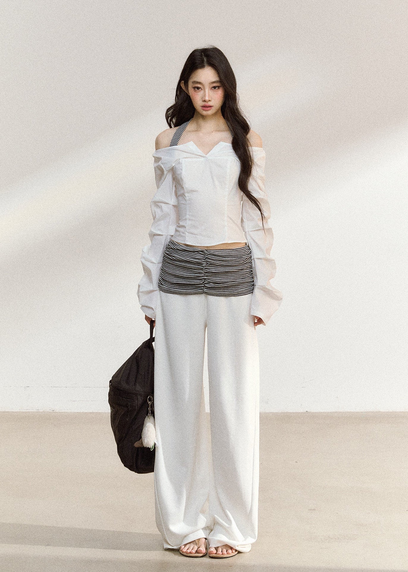 White wide-leg trousers with a ruched striped waistband