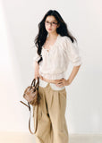White cotton blouse with gathered wave pleats and puff sleeves