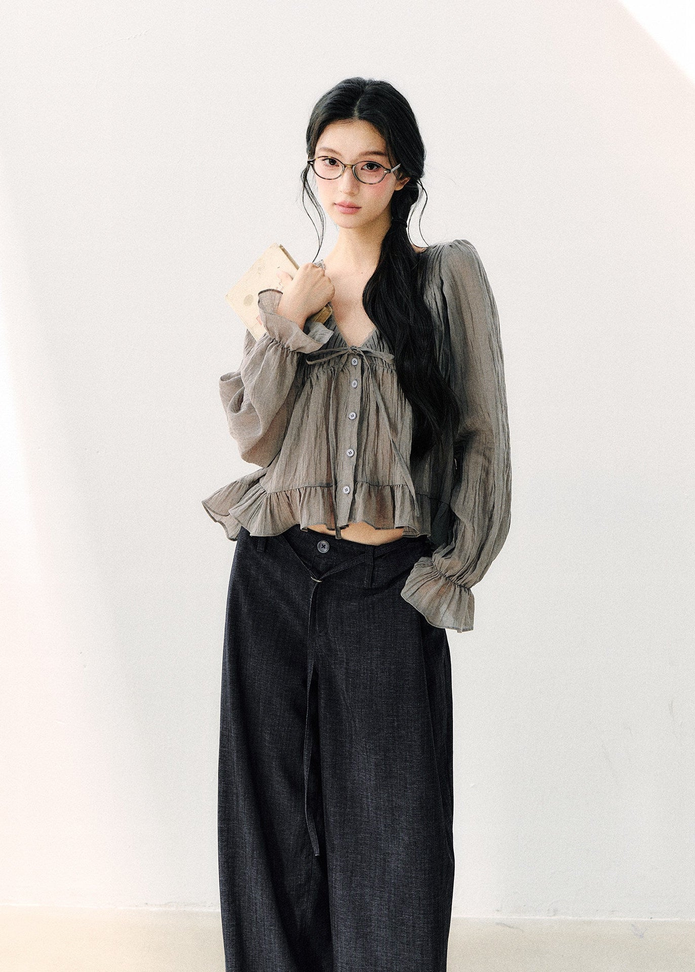 Smoky gray ruffled V-neck blouse with front ties