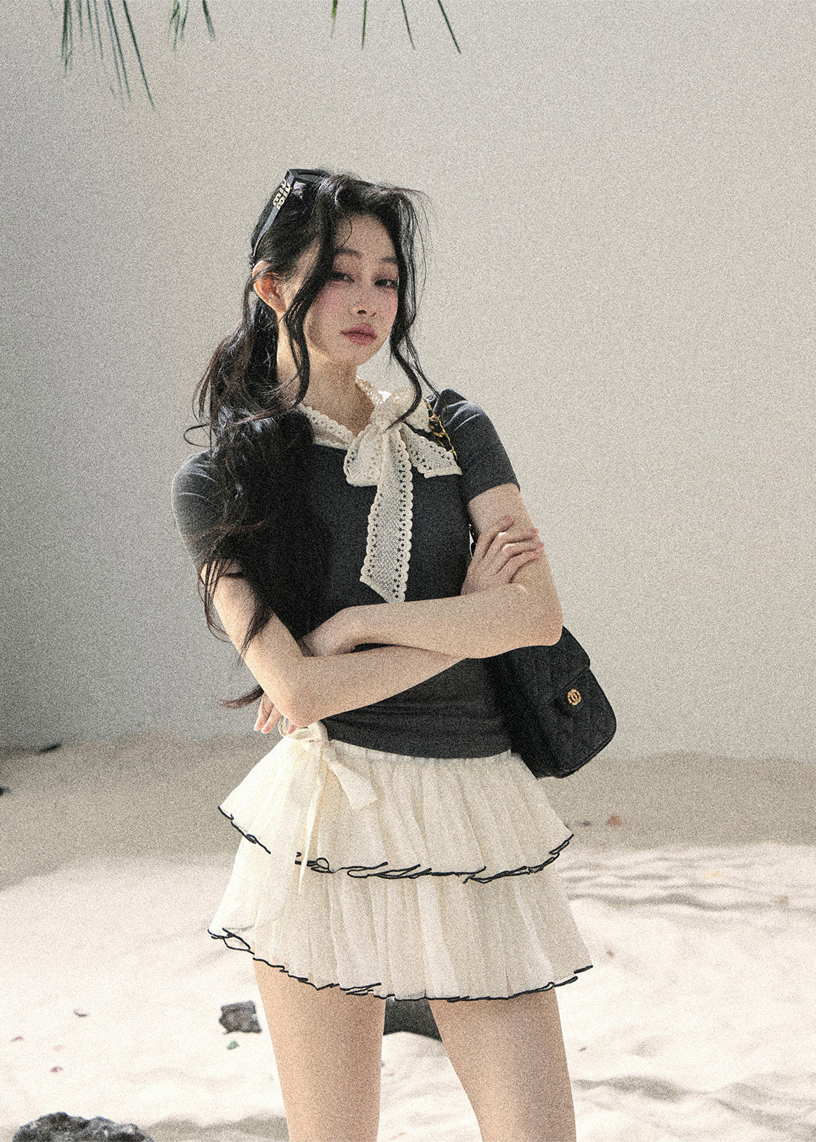 Gray fitted short-sleeve top with ivory lace bow neckline