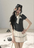 Gray fitted short-sleeve top with ivory lace bow neckline
