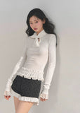 AOMALM top, Korean style knit top, fungus ruffle hem, bow lace T-shirt, winter feminine top, lace cuff long sleeve, soft knit blouse, aesthetic Korean fashion, winter layering top, slim fit tee women, elegant knitwear, ruffle lace shirt, cute winter tops, Korean girl outfit, soft girl aesthetic top, feminine long sleeve tee, winter fashion 2025, trending Korean tops, lace trim sweater top, chic bow neck shirt, romantic knit top.